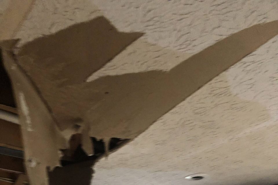 Water-damaged ceiling finish above a kitchen