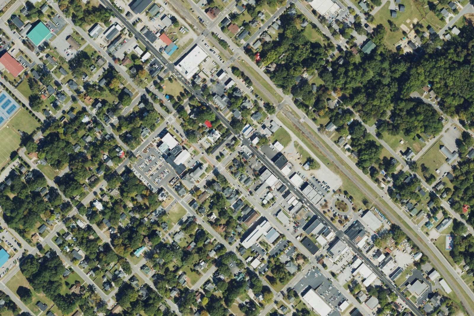USDA aerial photograph of Clayton, North Carolina, showing homes, larger buildings, streets and tree cover in 2022