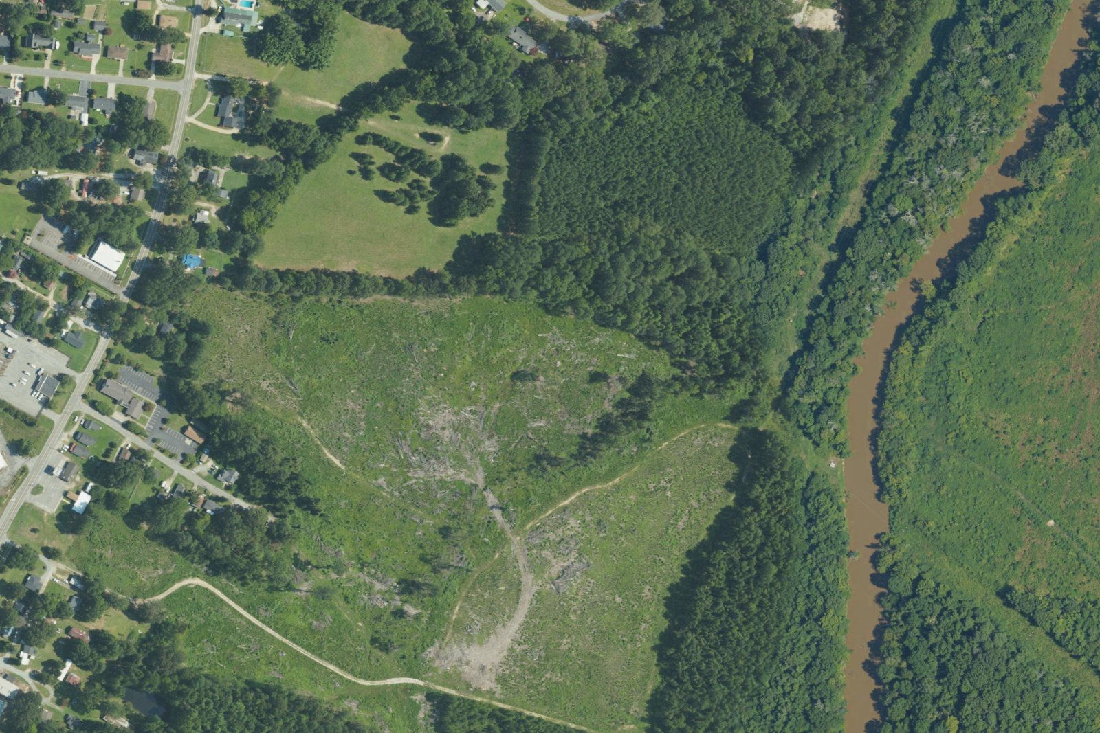 USDA aerial photograph of Smithfield, North Carolina, showing homes beside a wooded river corridor in 2022